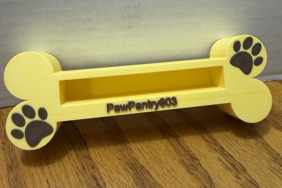 Yellow bone business card holder with paw prints