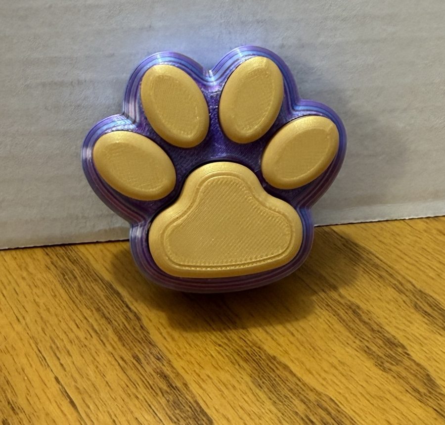 Purple and gold paw print fidget