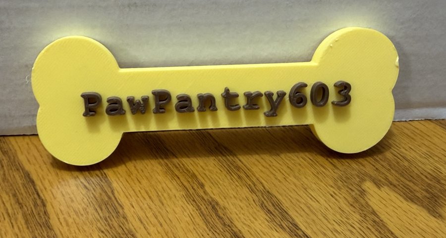 Yellow bone fridge magnet reading PawPantry603