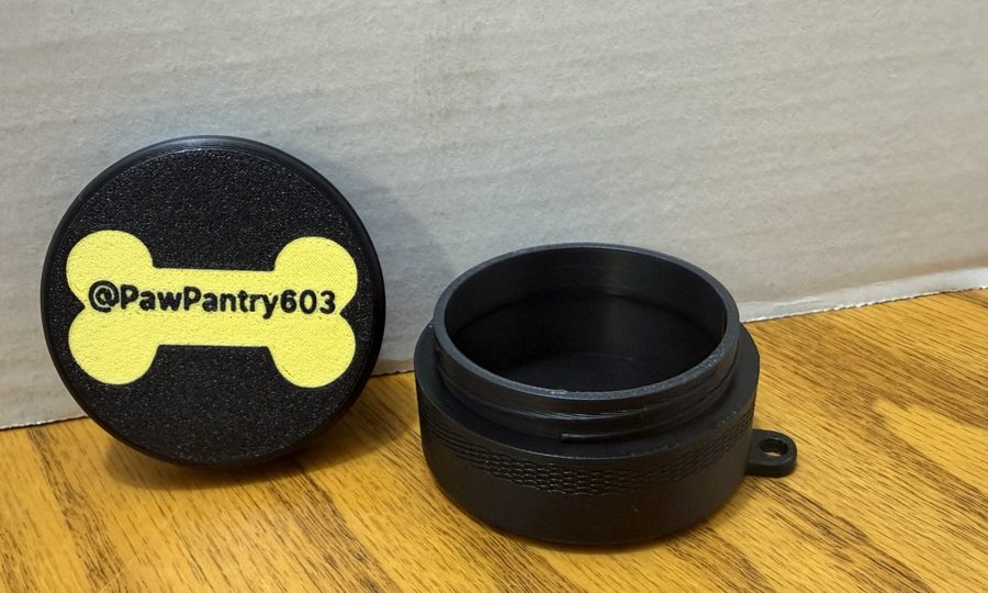 Black screw-top treat holder with PawPantry603 bone lid